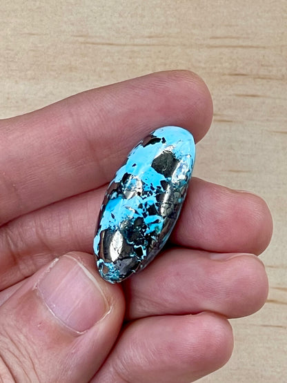 Turquoise Cabochon from Kerman Mine, Iran. With Pyrite Crystals. #K1